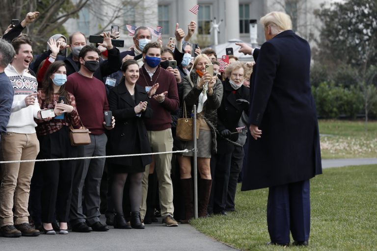 Trump supporters cheer as presidential helicopter flies over Washington rally
