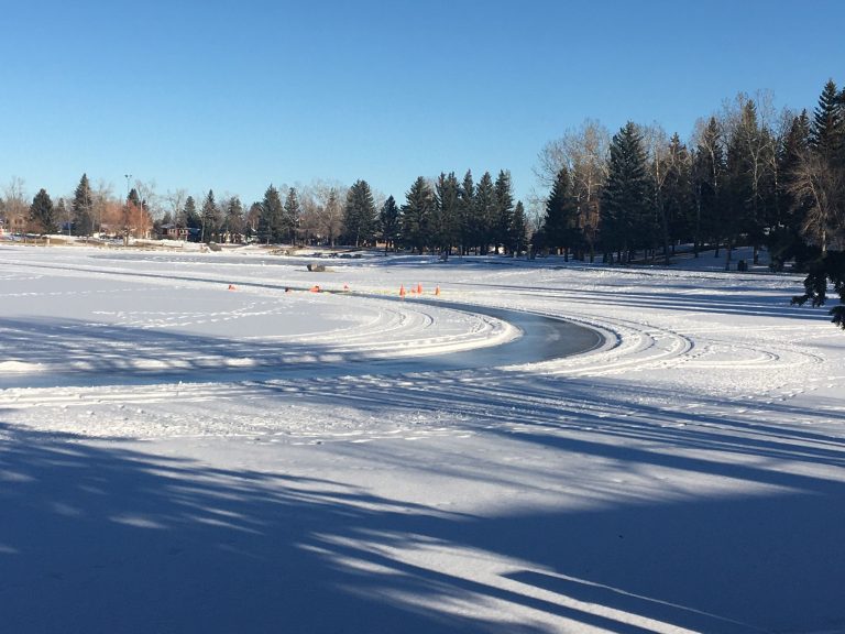 Woman in stable condition after falling through ice while operating tractor: Calgary fire