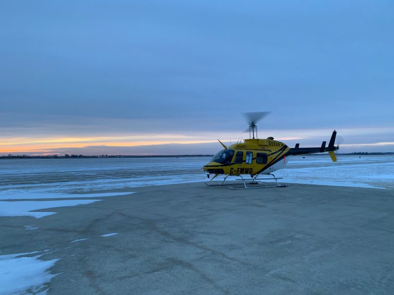 Helicopter crew rescues two men on Lake Winnipeg after ice breaks away from mainland