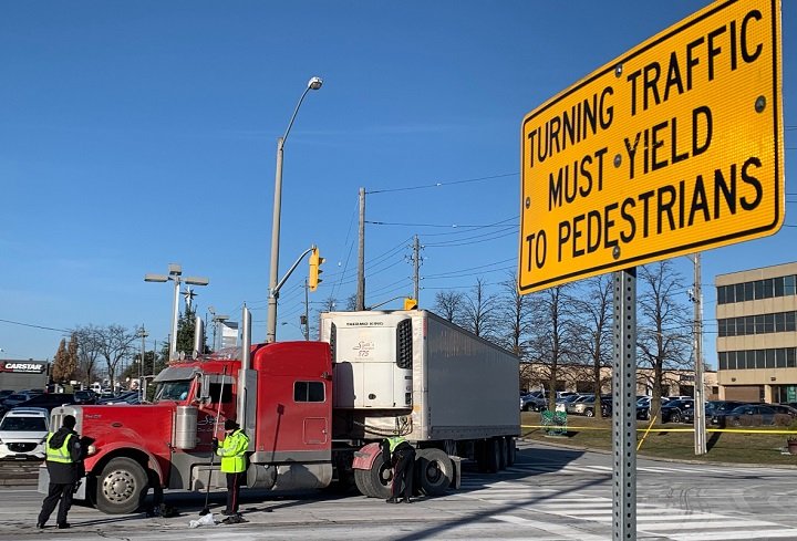Man dead after being hit by transport truck in Toronto’s east end, police say