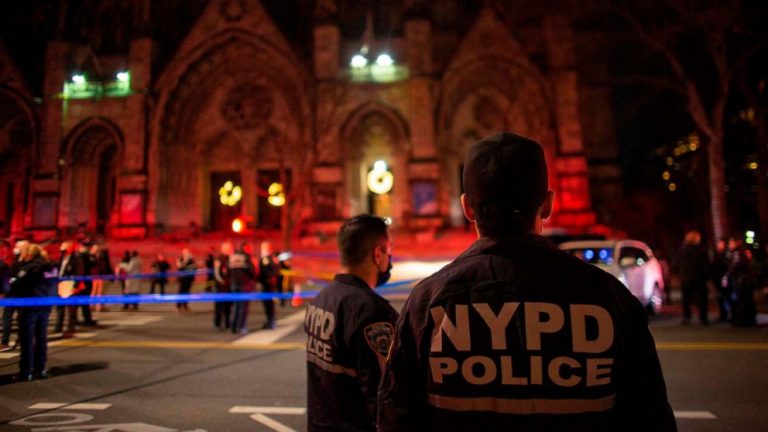 Police kill gunman who opened fire while carolers sang outside cathedral