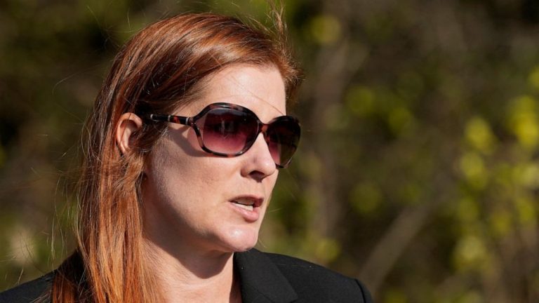 Woman charged in threats against Michigan election official