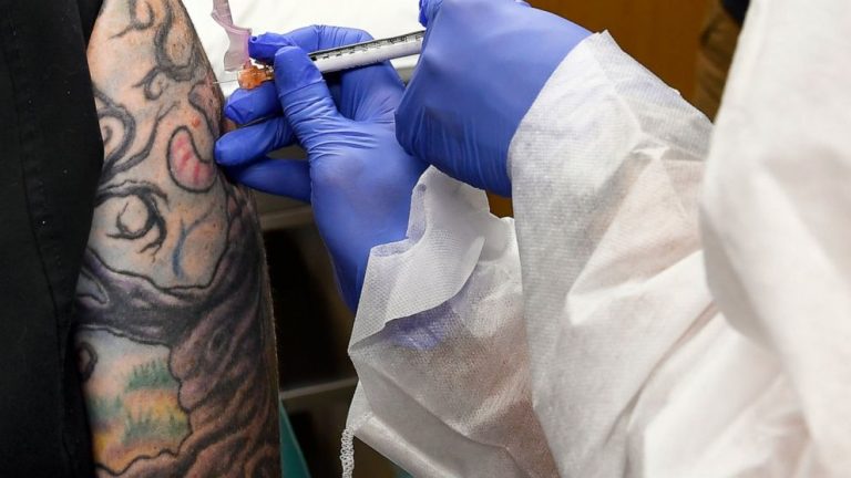 AP-NORC poll: Only half in US want shots as vaccine nears