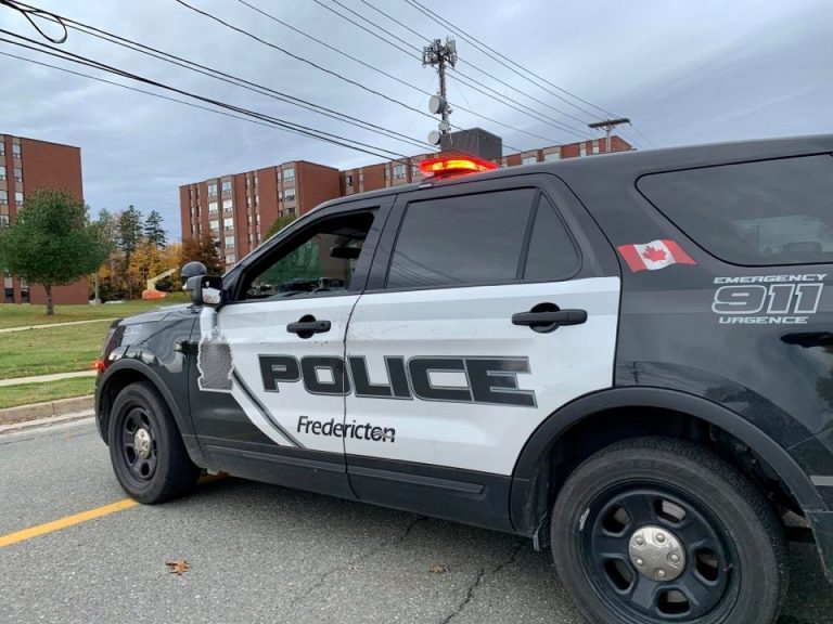 Fredericton police arrest man, search for another after police cruiser struck by vehicle