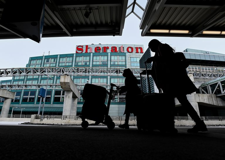 Travellers booking COVID-19 quarantine hotels report long wait times, lack of options