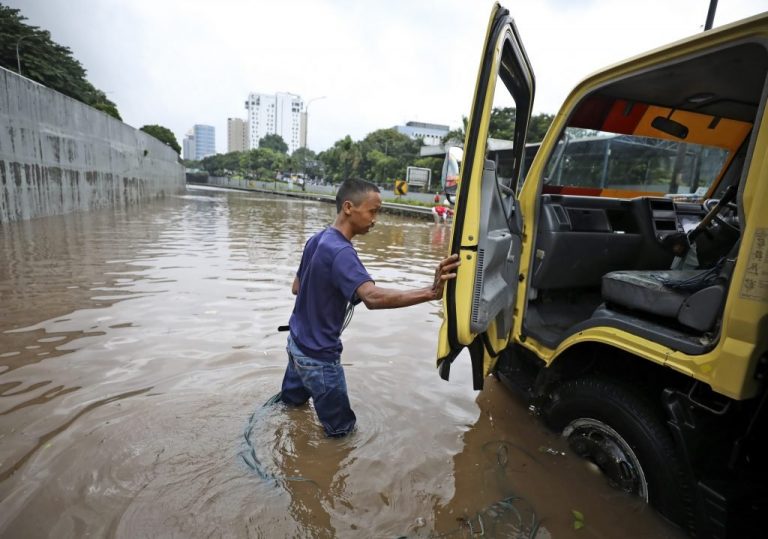 Monsoon flooding in Indonesia’s capital forces over 1,300 to flee their homes