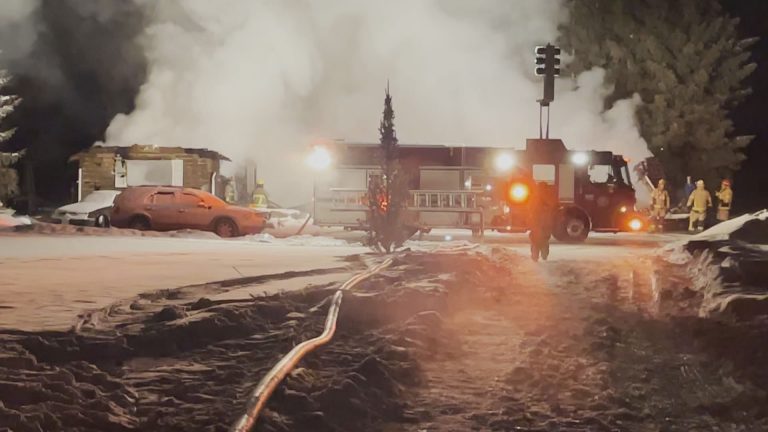 Crews battle frigid temperatures extinguishing house fire west of Calgary