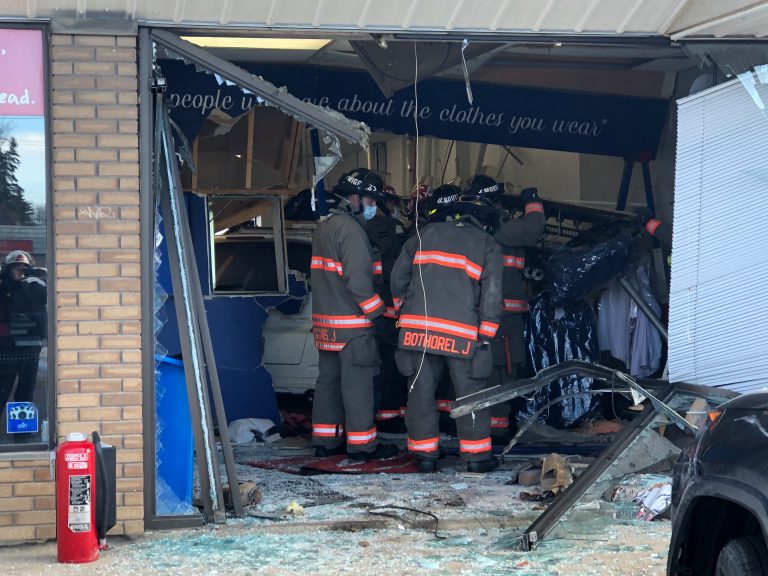 Woman seriously injured after minivan drives into store in Saskatoon