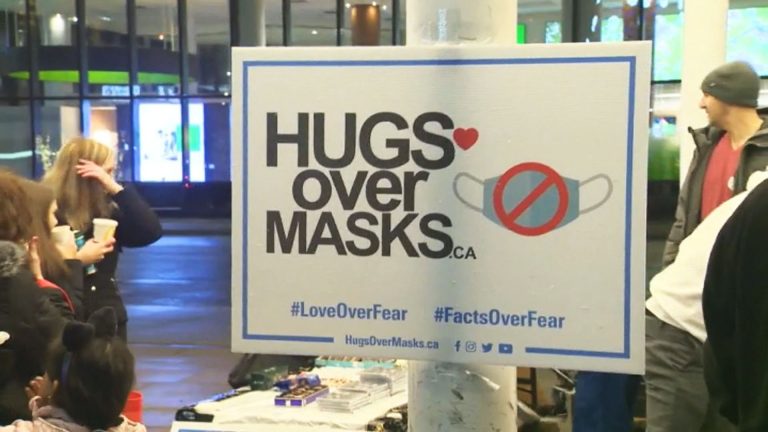 ‘Hugs Over Masks’ protesters charged after Sunday demonstration at Hamilton city hall