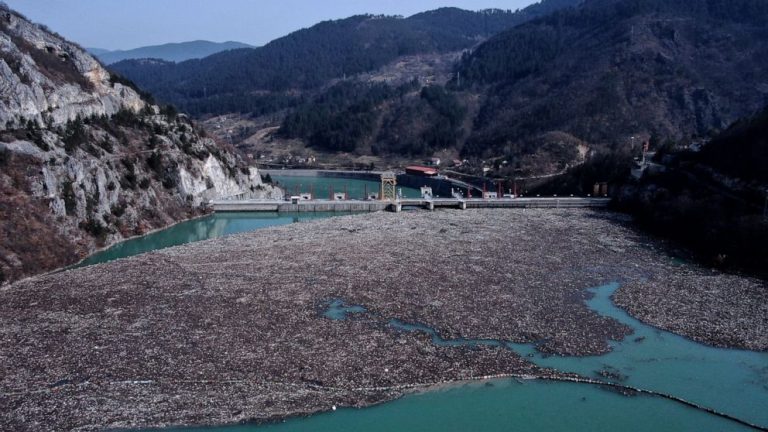 Trash fills Bosnia river faster than workers can pull it out