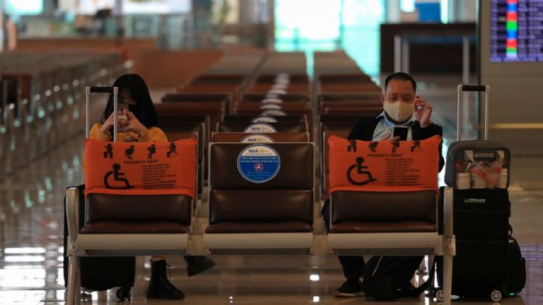 WHO chief warns of complacency as global virus cases drop