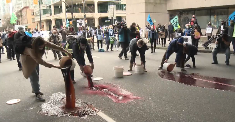Climate activists dump fake blood in front of B.C. Supreme Court ‘to demand action’