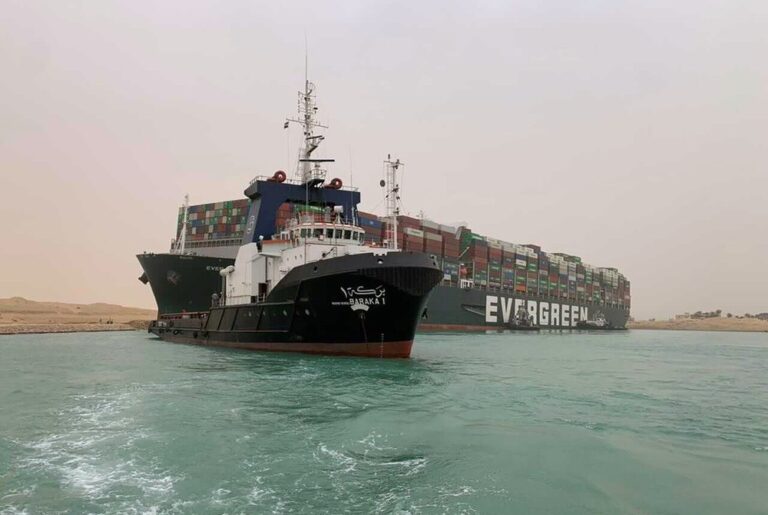 Work to clear massive cargo ship blocking Suez Canal slowed by low tide