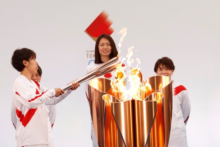 With waves but no cheers, Tokyo Olympics torch relay kicks off in Japan
