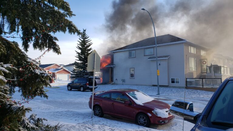 Crews battle house fire in northwest Calgary