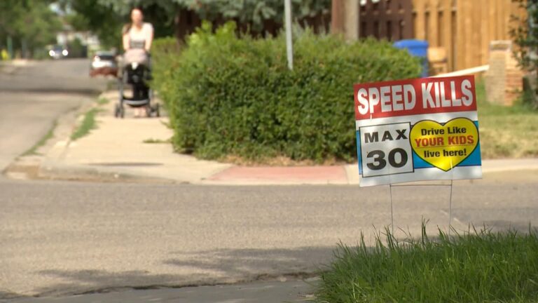 Signs urge drivers to slow down on 15th Avenue in Regina