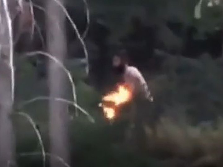 Video shows shirtless man tossing burning object into bush behind West Kelowna home