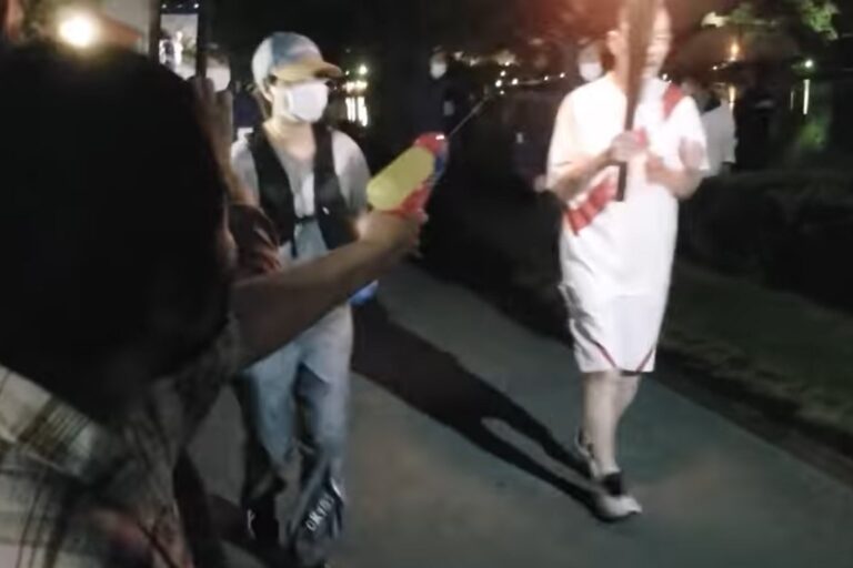 Woman arrested for allegedly shooting Olympic torch with water gun