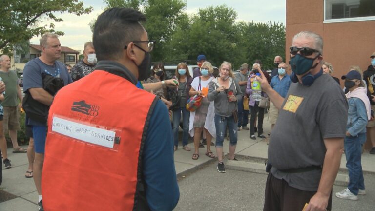 Frustrated White Rock Lake wildfire evacuees gather at ESS centre looking for answers