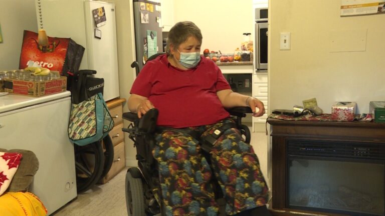 A Kingston woman says living at a KFHC building is impacting her well-being