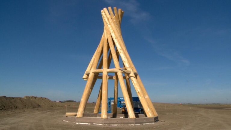 Wooden teepee raised at new FSIN building in Saskatoon