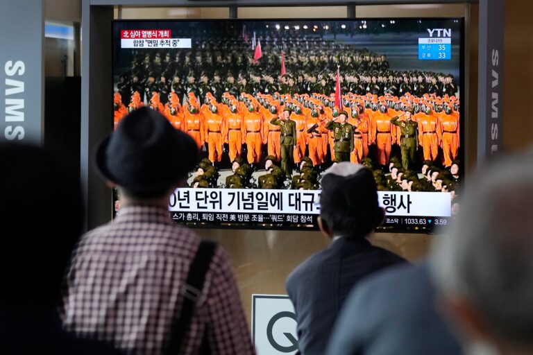 North Korea stages pared-down military parade featuring hazmat suits, few weapons