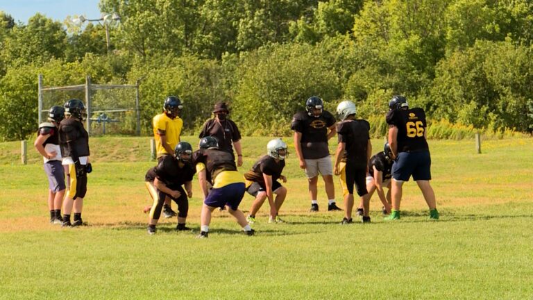 High School football players in Kingston thrilled to be back playing the game they love