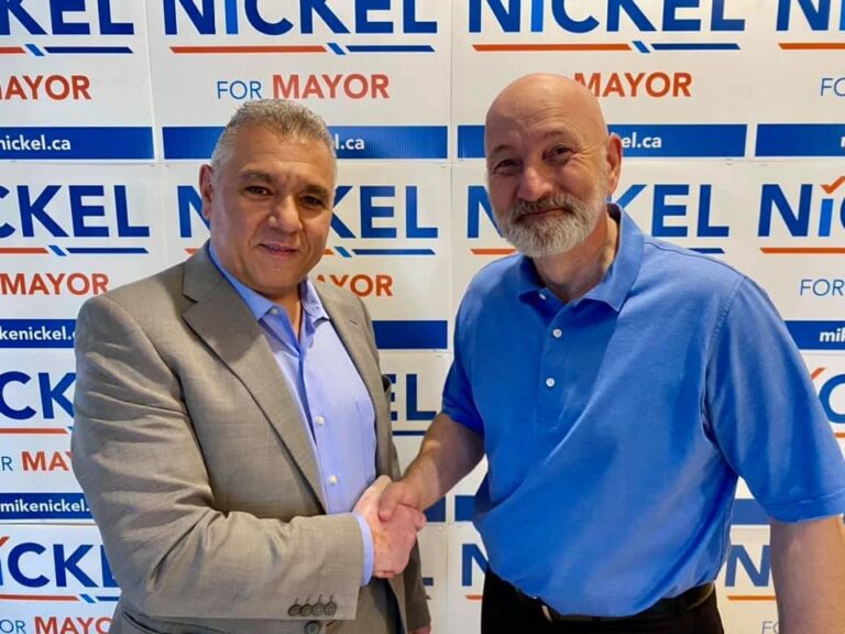 Edmonton mayoral candidate giving and receiving endorsements from other candidates