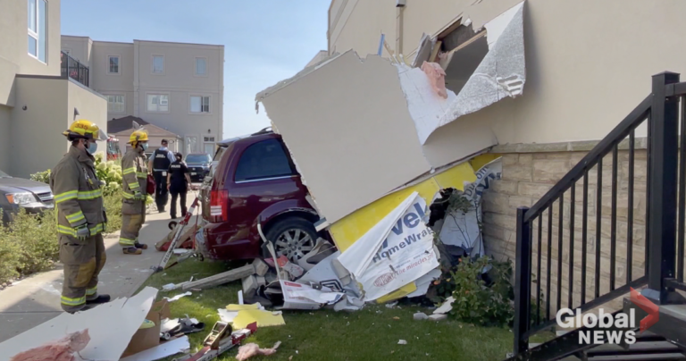 2 trapped after minivan crashes through building in Cobourg