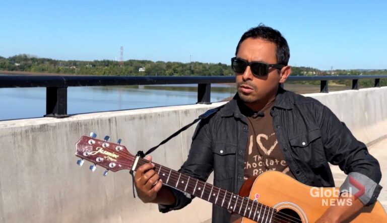 Tidal bore surfer pens song for new Petitcodiac River bridge