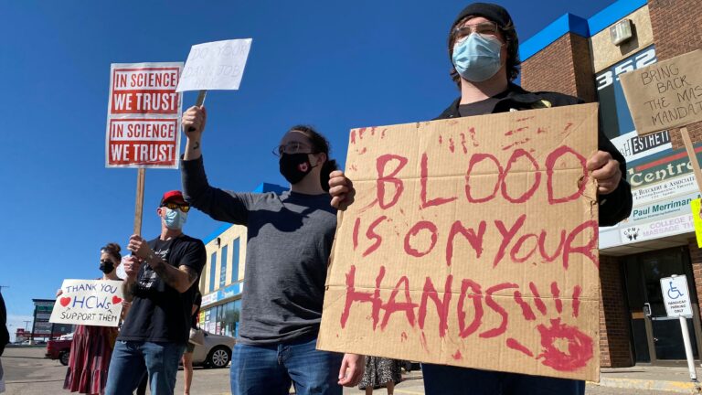 Protest outside Saskatchewan health minister’s office calls for public health measures