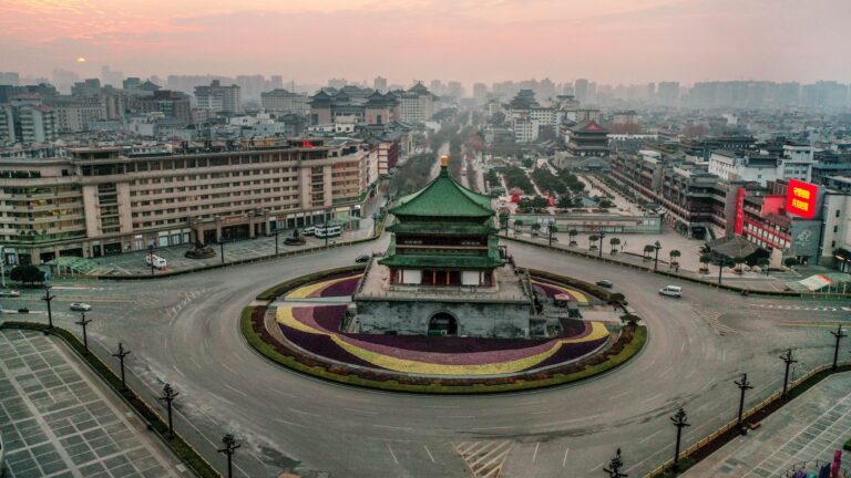 3rd Chinese city locks down as COVID-19 cases spike, isolating 20 million people