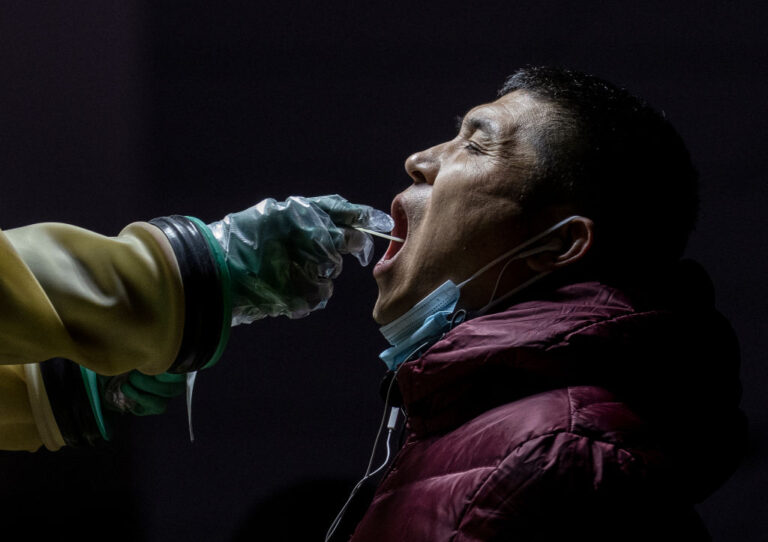 Employees locked inside office tower after single Omicron case in Beijing
