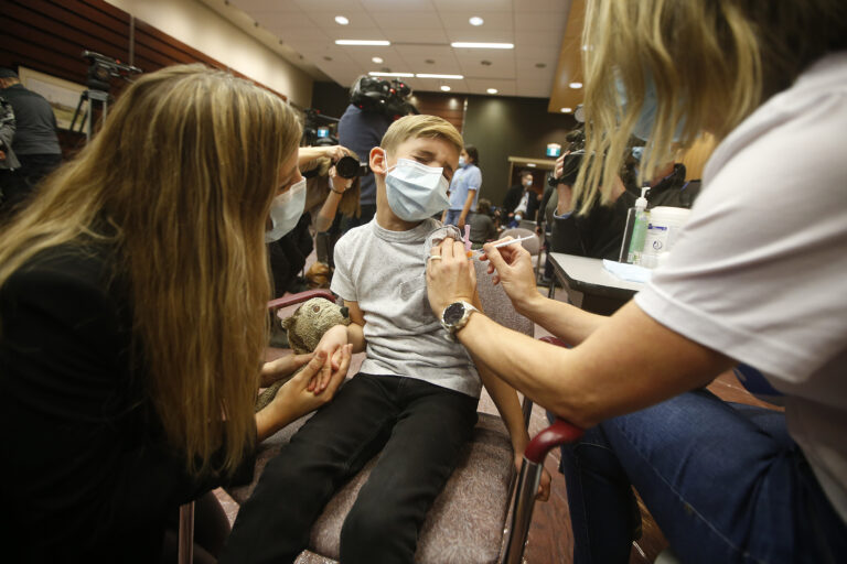 As Omicron spreads, kids 5-11 vaccination slows. That must change, experts say