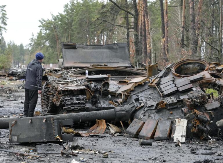 Ukrainian forces retake areas near Kyiv as Zelenskyy warns of traps