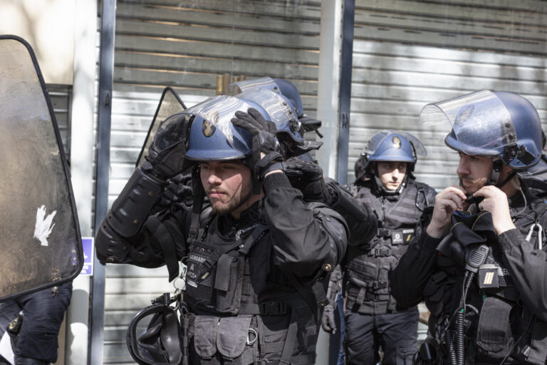 Riot police charge and spray teargas on Paris protestors after Macron victory