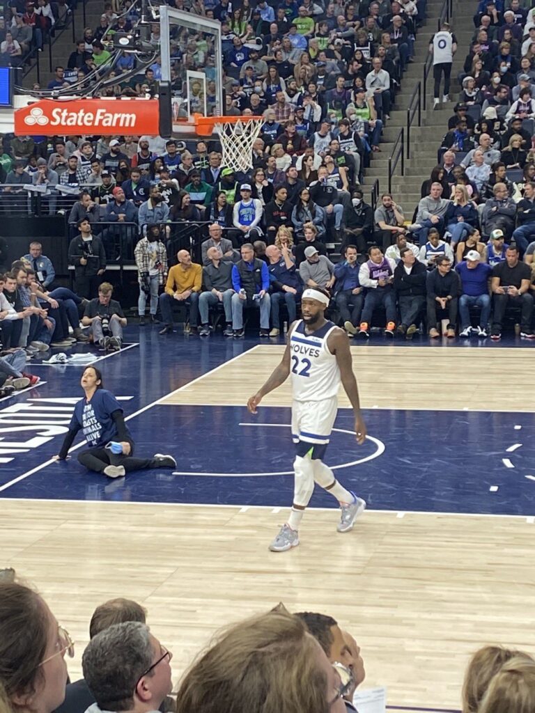 Animal rights activist superglues herself to NBA court mid-game