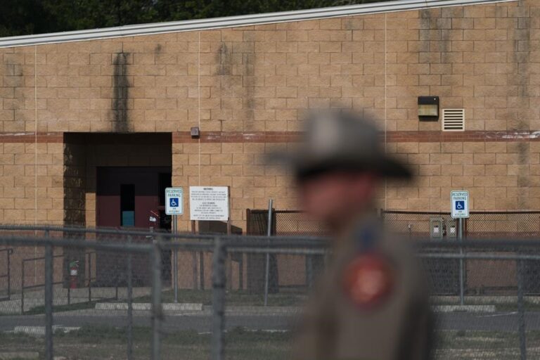 Teacher closed propped open door before Texas mass school shooting, police say