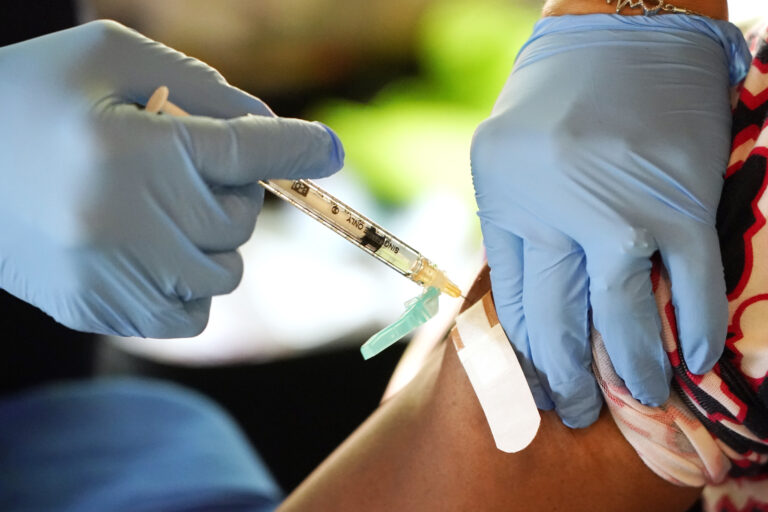 Don’t wait for updated COVID-19 vaccines if you’re high risk, experts say