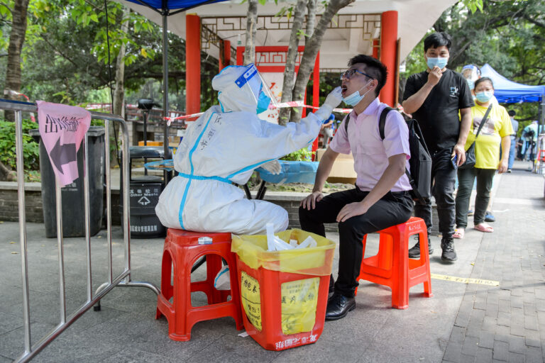 New wave of COVID-19 sweeps Asia, NZ as authorities warn of pressure on health care