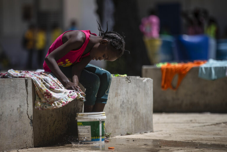 315 children, adults shelter in high school to flee Haiti gang violence