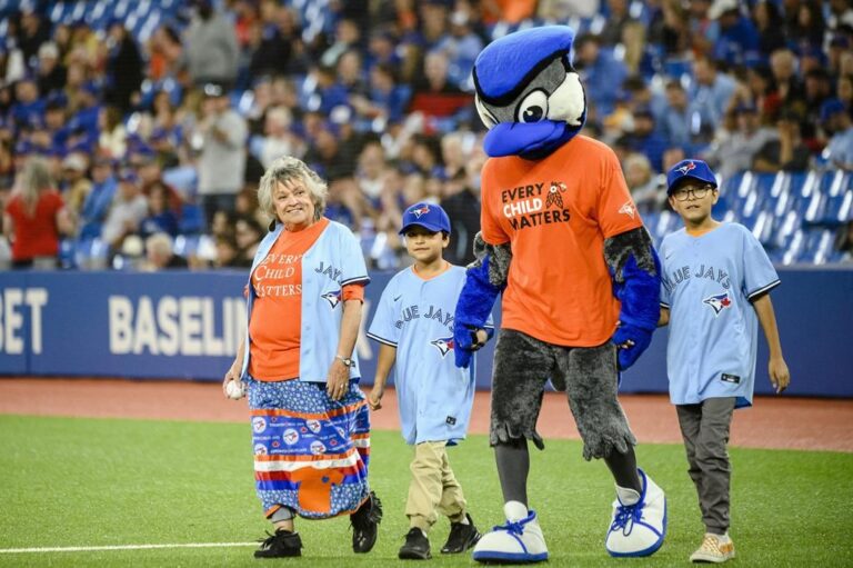Residential school survivor throws first pitch