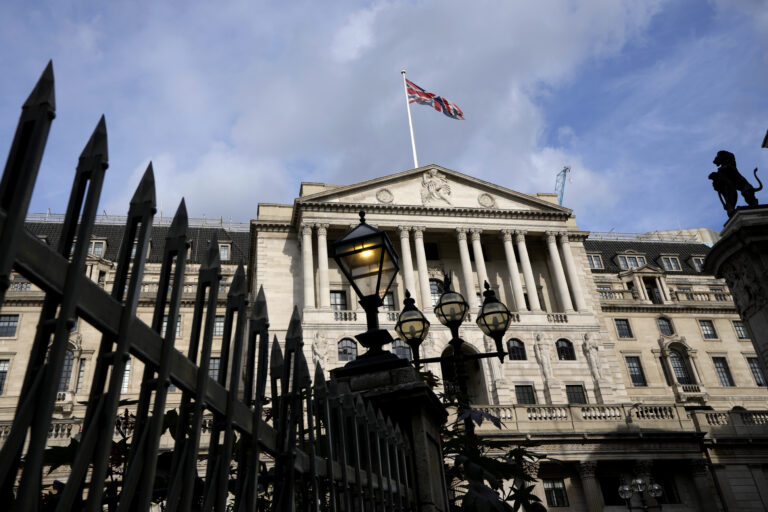 Bank of England warns of more interest rate hikes as pound hits record low