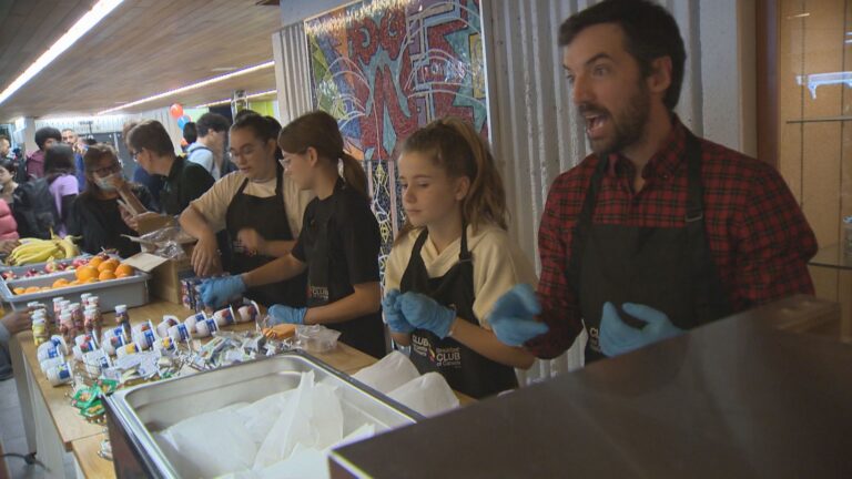Olympic speed skater Charles Hamelin serves up breakfast to South Shore students