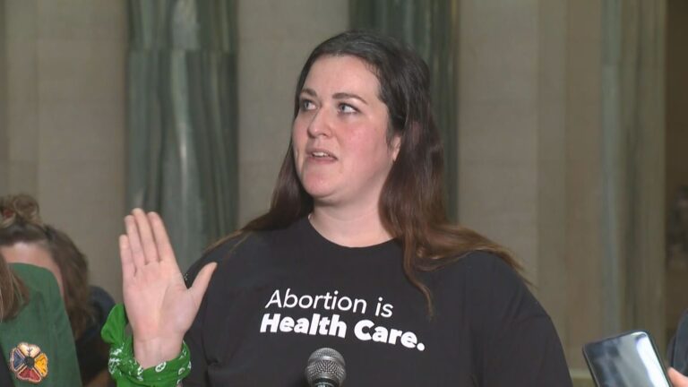 Policy under review after ‘abortion is health care’ T shirt banned at legislature