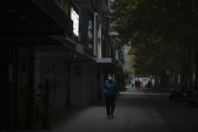China expands COVID-19 lockdowns as infections hit daily record