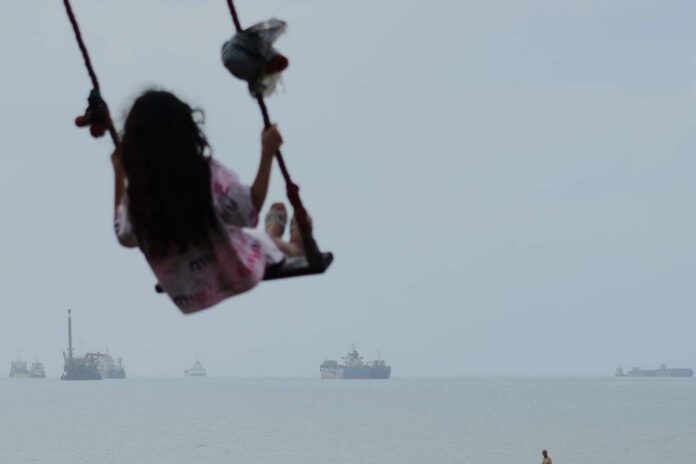 Iran, US make opposing claims of peace talks as cargo ships report strikes